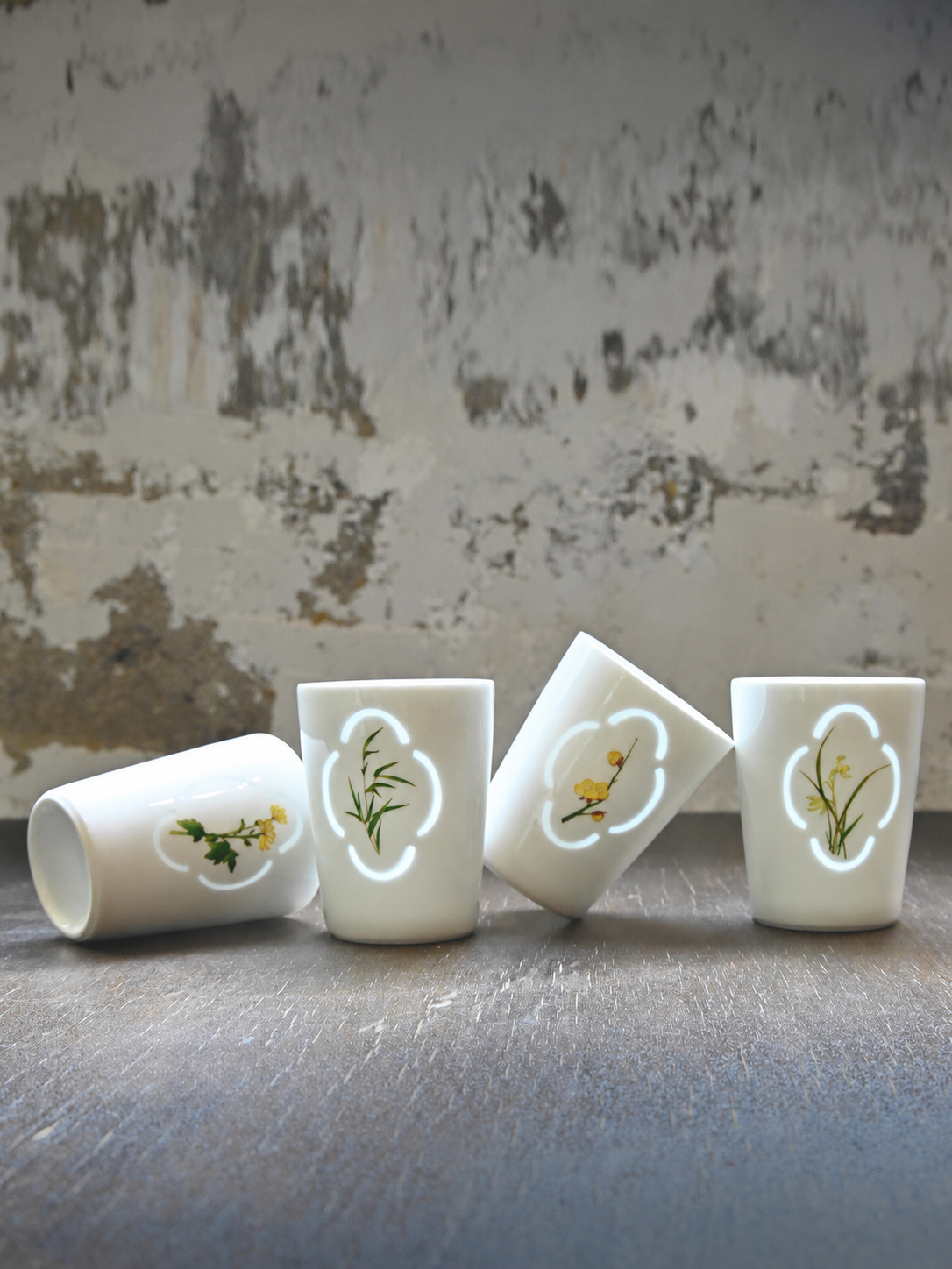 Four illuminated Linglong porcelain cups