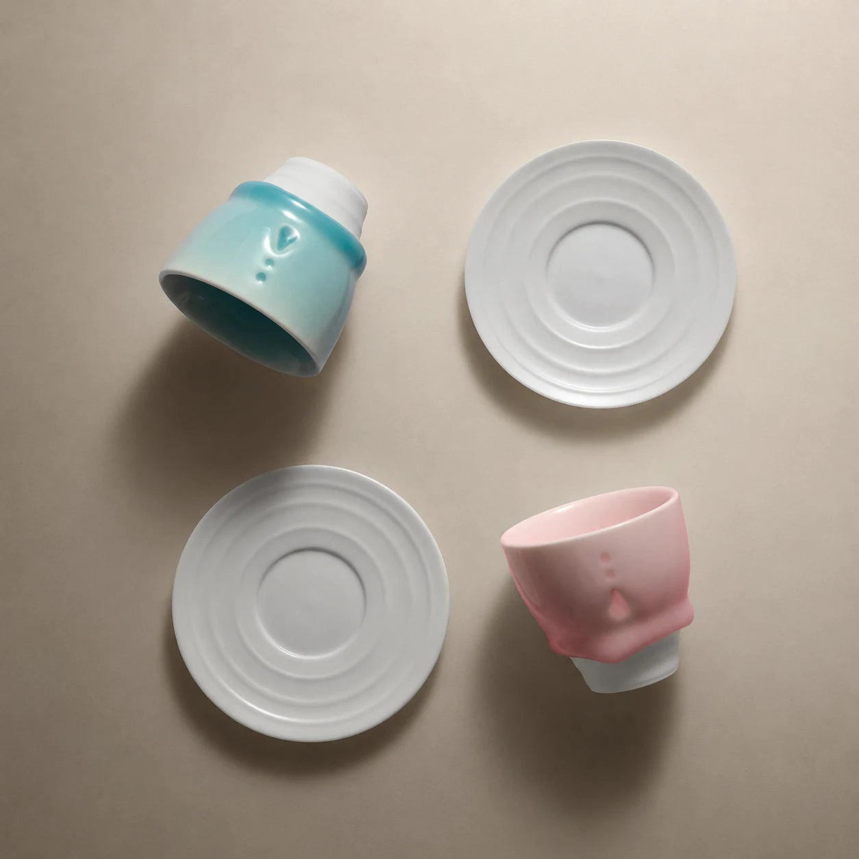 Pastel ceramic cups and white saucers