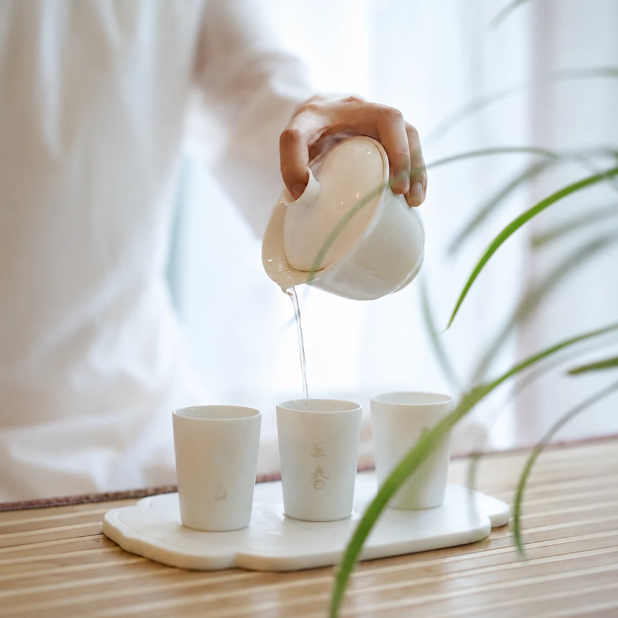 Tea poured into white porcelain cups