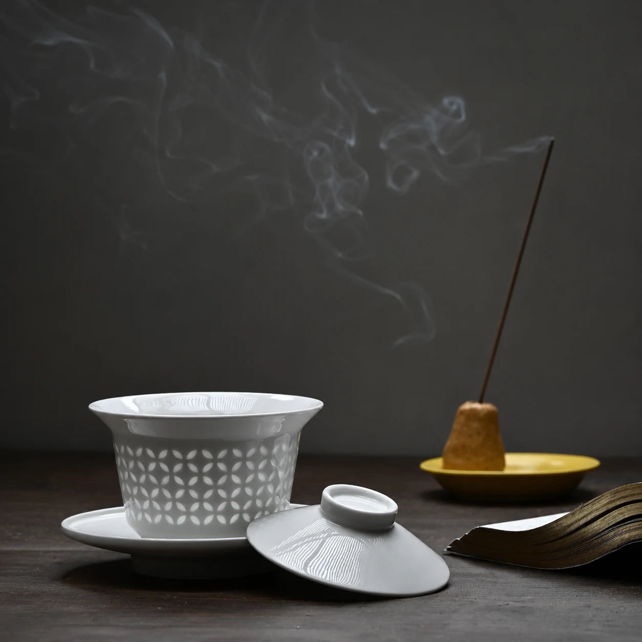 White ceramic tea set and incense